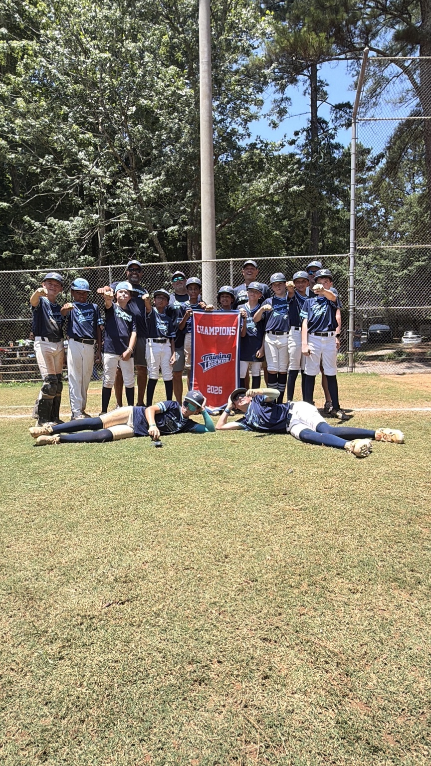 Jasiah Mize and the Smyrna Slammers celebrating a 2026 Training Legends championship